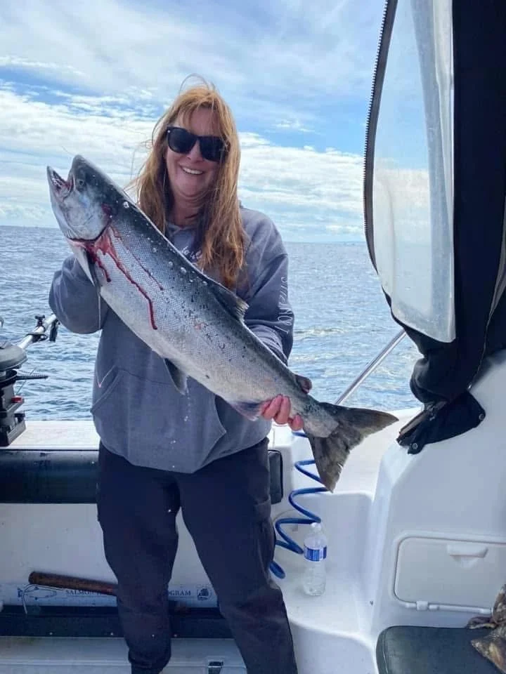 Woman with Chinook on Conquest